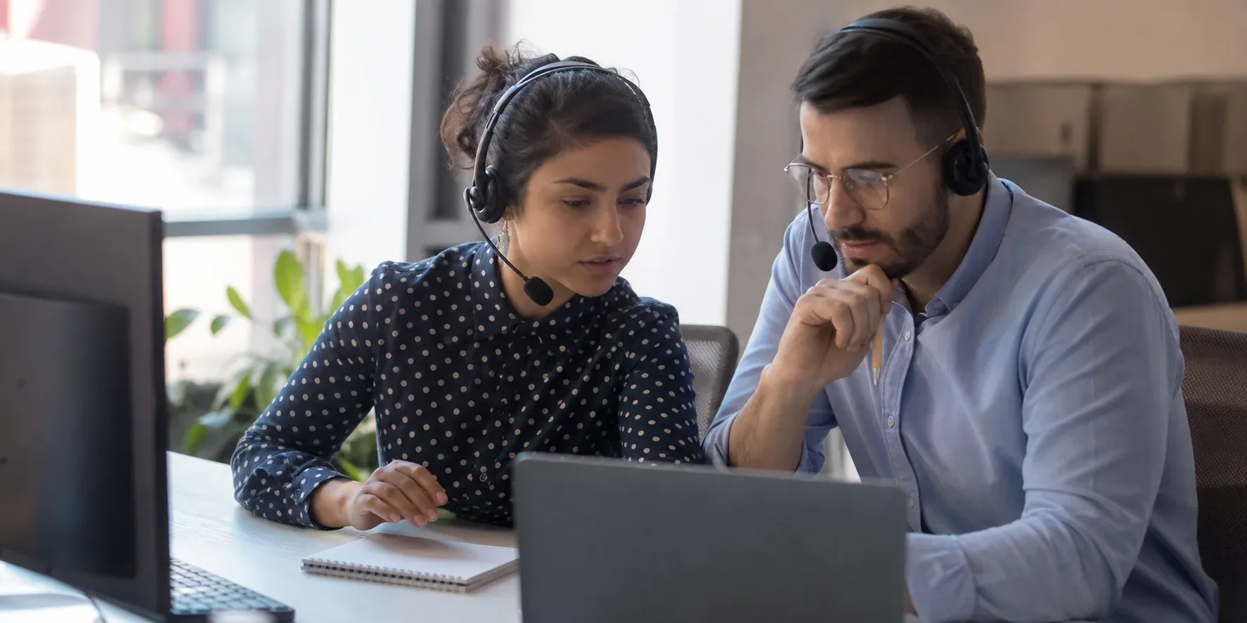 A support agent and supervisor reviewing a sensitive escalated customer case